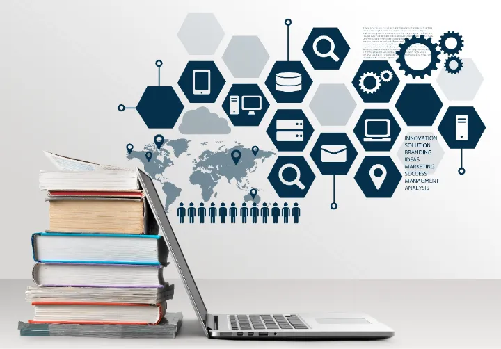 Books and a laptop representing knowledge systems